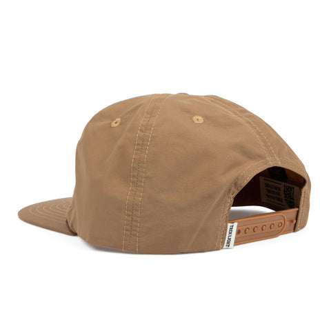 Back view of the Howdy Hat, a 5-panel snapback in beige nylon with vent holes, flat brim, and adjustable strap by Trek Light.