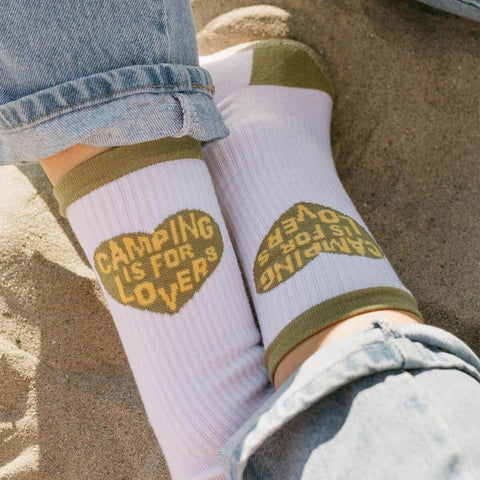Cozy Trek Light socks with 'Camping Is For Lovers' heart design, perfect for adventurous spirits and comfy feet on all journeys.