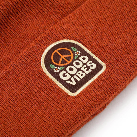 Good Vibes Kids Beanie by Trek Light, cozy rust-brown hat with peace symbol patch, perfect for spreading good vibes and warmth.