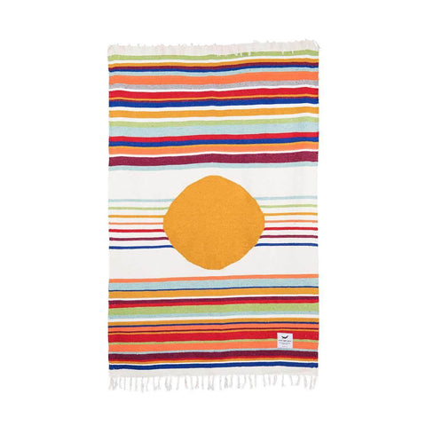 Trek Light Halley's Comet Blanket with colorful stripes and orange circle, handmade from recycled materials. Eco-friendly and unique design.