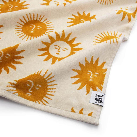 Trek Light Sunny Bath Towel with sun pattern, 100% sustainable cotton, soft and absorbent 550 GSM, eco-friendly luxury.