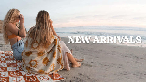 Discover our New Arrivals, featuring Trek Light towels on the beach. Perfect for your next adventure!