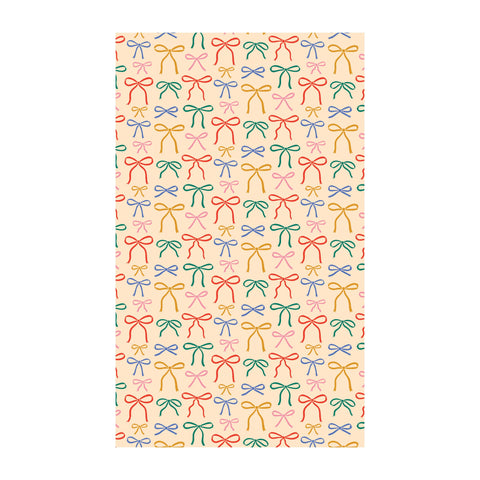 Colorful patterned kitchen tea towel with vibrant bows, eco-friendly, absorbent, quick-drying, made from 100% recycled materials.