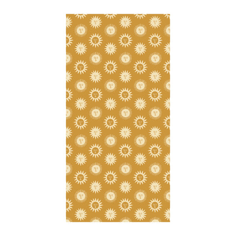 Sunny Wander Towel with unique sun pattern, quick-dry and sand-resistant, made from 100% recycled materials, ideal for travel.