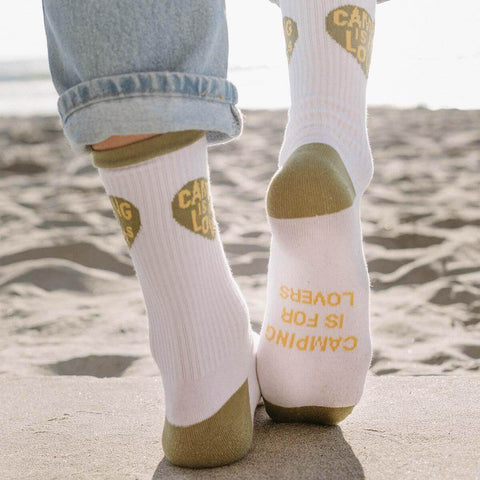 Cozy Trek Light socks with 'Camping Is For Lovers' design, perfect for adventures by the beach or mountains.