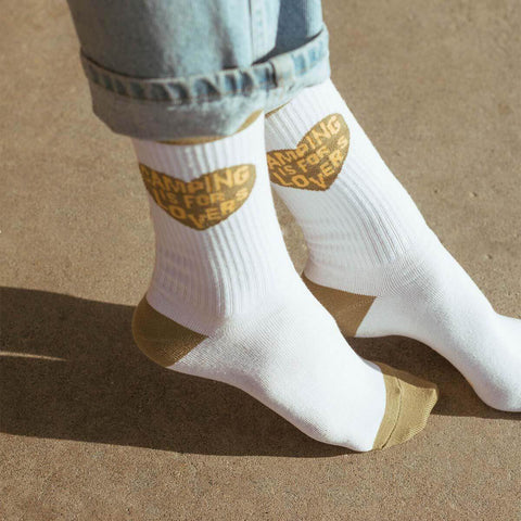Trek Light 'Camping Is For Lovers' cozy crew socks perfect for outdoor adventures, styled on a sunny day.