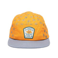 Vibrant orange 5-panel kids snapback hat, flat brim, with "Flower Child" patch. Perfect for young adventurers. Trek Light.