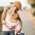 Kids in Trek Light Go Outdoors Corduroy Hats hugging, perfect for outdoor adventures. Eco-friendly style.