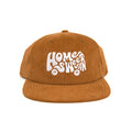 Stylish brown Home Sweet Van hat featuring white embroidery, perfect for van life enthusiasts. Trek Light's fun corduroy snapback cap.