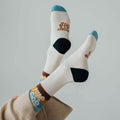 Stay Wild socks by Trek Light on feet, showcasing trendy design with perfect stretch and cushion for ultimate comfort and style.