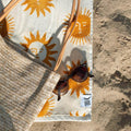 Trek Light Sunny Bath Towel with sun design on sandy beach