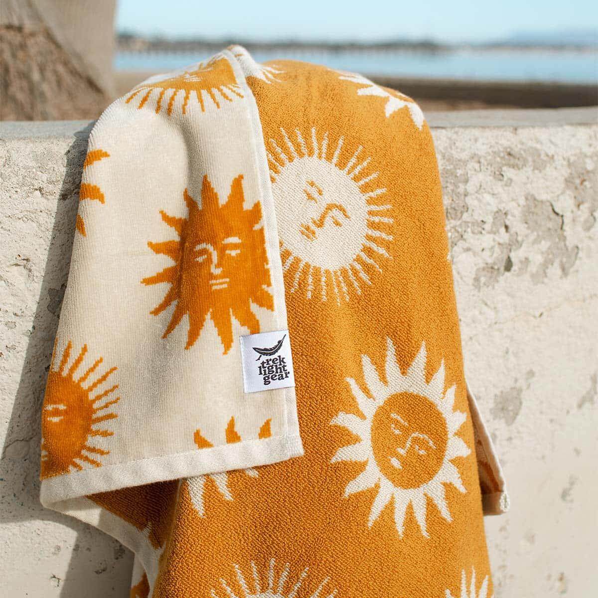 https://www.treklightgear.com/cdn/shop/products/sunny-bath-towel-trek-light-2.jpg?v=1677184995&width=1946